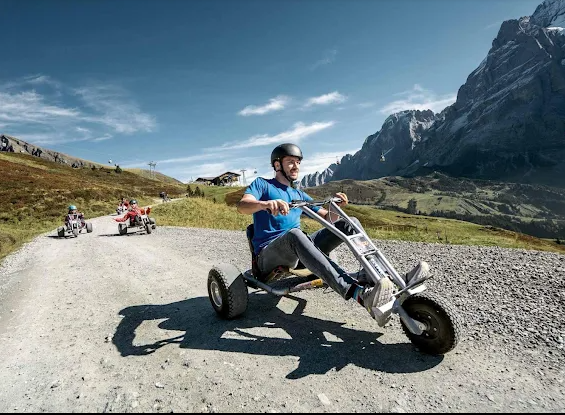 Riders taking mountain carts down an alpine trail at Grindelwald First, photo supplied by you