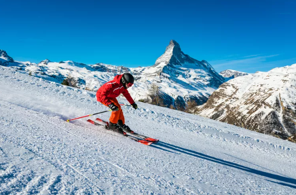 Skier with the Matterhorn in the Swiss Alps, image supplied by you